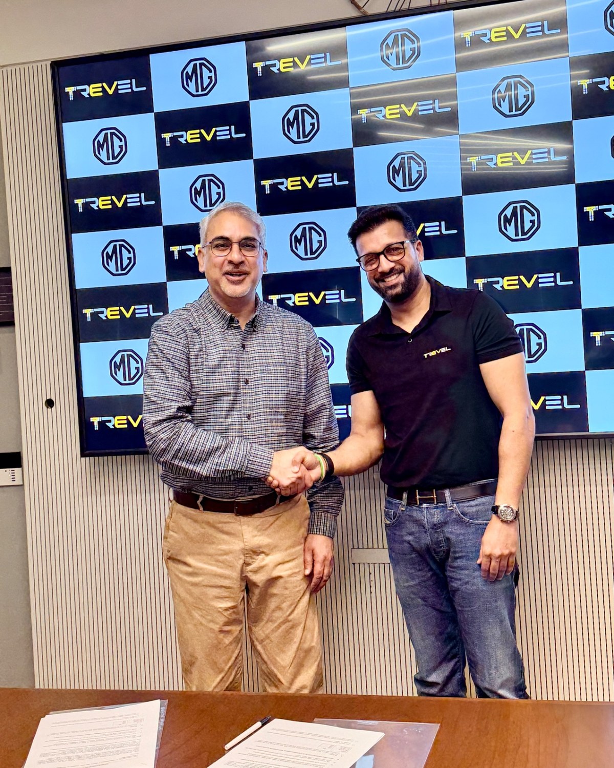 Sahil Jindal shaking hands at the Trevel and MG Motor partnership signing